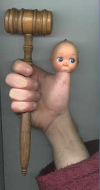 gavel and doll's
head